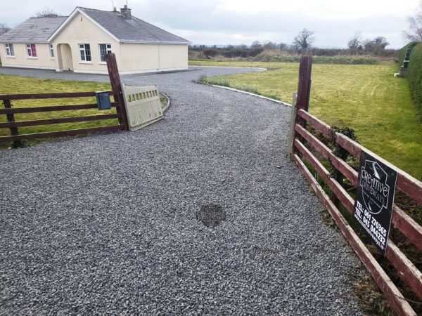 Gravel being laid on a driveway in Shannonbridge